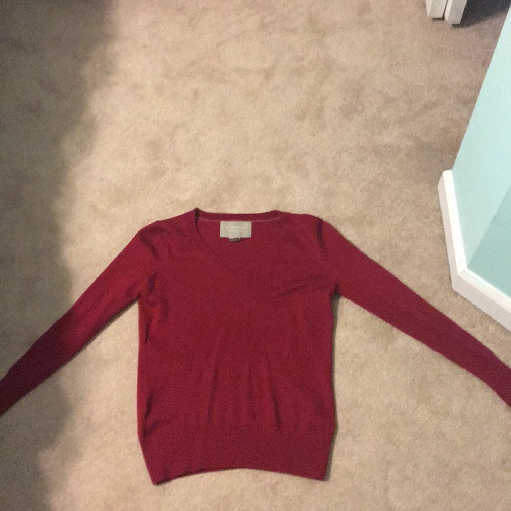 a red women’s sweater